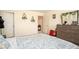 Bright bedroom features a large dresser, an entryway, and tasteful decor at 3469 English Elm Way, Loganville, GA 30052