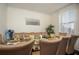 Formal dining room with seating for eight, stylish decor, and plenty of natural light, ideal for hosting gatherings at 3469 English Elm Way, Loganville, GA 30052