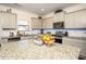 Modern kitchen featuring granite countertops, stainless steel appliances, and a functional center island at 3469 English Elm Way, Loganville, GA 30052