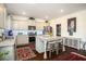 Well-equipped kitchen with stainless steel appliances, ample cabinet space, a center island, and stylish decor at 3469 English Elm Way, Loganville, GA 30052