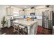 Modern kitchen with granite countertops, stainless steel appliances and a center island with seating at 3469 English Elm Way, Loganville, GA 30052