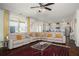 Bright and inviting living room featuring a large sectional sofa and an open floor plan concept at 3469 English Elm Way, Loganville, GA 30052