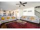 Comfortable living room with an open concept floor plan that includes the kitchen and staircase at 3469 English Elm Way, Loganville, GA 30052