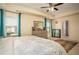 Comfortable main bedroom with ensuite bath, carpet floor, tray ceiling, and lots of light at 3469 English Elm Way, Loganville, GA 30052