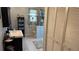 Updated bathroom features a vanity, toilet, a window, and a neutral color scheme at 705 Mill Creek Rdg, Woodstock, GA 30188