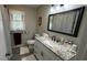Bathroom featuring a sink with granite countertops and black hardware at 705 Mill Creek Rdg, Woodstock, GA 30188