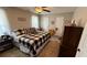Cozy bedroom with a bed, neutral walls, ceiling fan, and lots of natural light at 705 Mill Creek Rdg, Woodstock, GA 30188