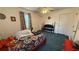 Bedroom featuring a ceiling fan, patterned curtains, and a view to the outside at 705 Mill Creek Rdg, Woodstock, GA 30188