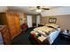 Bedroom with carpet, ceiling fan, and furniture at 705 Mill Creek Rdg, Woodstock, GA 30188