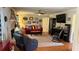 Comfortable living room features hardwood floors, a fireplace, and neutral color palette at 705 Mill Creek Rdg, Woodstock, GA 30188