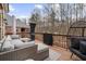 Back deck with a seating area provides an excellent outdoor space for relaxation and entertainment at 1525 Camden Cove Dr, Cumming, GA 30040