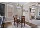 Dining room showcases a wooden table and chairs, complementing the hardwood flooring and natural light at 1525 Camden Cove Dr, Cumming, GA 30040