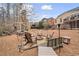 Relaxing backyard firepit surrounded by mature trees and manicured landscaping at 1525 Camden Cove Dr, Cumming, GA 30040