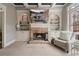 Living room with fireplace, built-in shelving, and a comfortable chair provides a welcoming atmosphere at 1525 Camden Cove Dr, Cumming, GA 30040