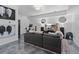 Bright living room with a sectional sofa, mounted television, speakers, and modern decor at 1525 Camden Cove Dr, Cumming, GA 30040