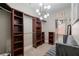 Spacious walk-in closet with custom shelving, lighting, and ample storage space at 1525 Camden Cove Dr, Cumming, GA 30040