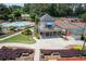 Aerial view of the pool, tennis courts and surrounding community amenities at 303 Valley Green Ct, Woodstock, GA 30189