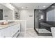 Modern bathroom with double vanity, granite countertop, and luxurious glass enclosed shower at 303 Valley Green Ct, Woodstock, GA 30189