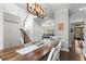 Open concept dining area with wood table at 303 Valley Green Ct, Woodstock, GA 30189