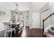 Formal dining room with stairs, neutral walls, and wood floors at 303 Valley Green Ct, Woodstock, GA 30189