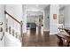 Inviting foyer with hardwood floors, stairs, and easy access to the home's common areas at 303 Valley Green Ct, Woodstock, GA 30189
