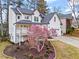 Beautifully landscaped front yard featuring a flowering magnolia tree and a charming two-story home at 303 Valley Green Ct, Woodstock, GA 30189