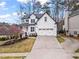 Inviting two-story home with a well-manicured lawn and a convenient two-car garage at 303 Valley Green Ct, Woodstock, GA 30189