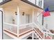 Quaint front porch with classic railing and sconce lighting at 303 Valley Green Ct, Woodstock, GA 30189