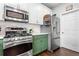 Updated kitchen boasts stainless steel appliances, modern cabinets, and an efficient layout at 303 Valley Green Ct, Woodstock, GA 30189