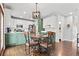 Eat-in kitchen with updated cabinets and countertops, modern lighting, and stainless appliances at 303 Valley Green Ct, Woodstock, GA 30189
