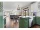 Open concept kitchen leading into breakfast and Gathering room; stainless appliances and modern colors at 303 Valley Green Ct, Woodstock, GA 30189