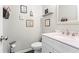 Cozy half bathroom with sink and decor at 303 Valley Green Ct, Woodstock, GA 30189
