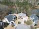 Beautiful aerial view of lakefront homes showcasing their spacious yards and proximity to the water at 335 Lake Bluff Ct, Suwanee, GA 30024