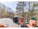 Relaxing outdoor deck area with comfortable seating and a grill, perfect for enjoying the lake views at 335 Lake Bluff Ct, Suwanee, GA 30024