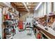 Unfinished basement with wood paneled walls and open shelving, ideal for storage or a workshop at 335 Lake Bluff Ct, Suwanee, GA 30024