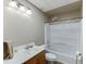 Cozy bathroom featuring a shower-tub combination with white tile and a clean white vanity at 335 Lake Bluff Ct, Suwanee, GA 30024