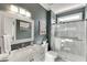 Bathroom featuring a vanity, shower, and decorative accents at 335 Lake Bluff Ct, Suwanee, GA 30024