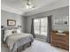 Cozy bedroom with neutral walls, natural light, and carpeted floor at 335 Lake Bluff Ct, Suwanee, GA 30024