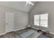 Bonus room with vaulted ceilings, natural light, and vinyl flooring at 335 Lake Bluff Ct, Suwanee, GA 30024