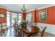 Elegant dining room featuring an oversized table, bay window, and refined decor at 335 Lake Bluff Ct, Suwanee, GA 30024