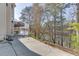 Home exterior featuring a lake view and a long driveway at 335 Lake Bluff Ct, Suwanee, GA 30024
