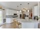Modern kitchen with white cabinets, granite countertops, stainless steel appliances, and a stylish backsplash at 335 Lake Bluff Ct, Suwanee, GA 30024