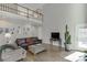 Modern living room with high ceilings, hardwood floors, and comfortable seating area at 335 Lake Bluff Ct, Suwanee, GA 30024
