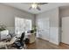 Home office featuring hardwood floors, natural light, and neutral paint at 335 Lake Bluff Ct, Suwanee, GA 30024