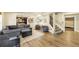 Spacious basement living area with sofa, chairs, billiards room, stairs, and exercise room at 4020 Toulon Ln, Cumming, GA 30040