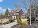 Beautiful home with manicured lawn, mature trees and shrubs, and a circular driveway, perfect for outdoor enjoyment at 4020 Toulon Ln, Cumming, GA 30040