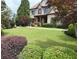 Well-manicured lawn and landscaping accentuates this beautiful brick home at 4020 Toulon Ln, Cumming, GA 30040