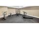 Home gym with weights, treadmill, and open floor plan at 4020 Toulon Ln, Cumming, GA 30040