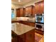Gourmet kitchen with stainless steel appliances, granite countertops, and ample cabinet space at 4020 Toulon Ln, Cumming, GA 30040