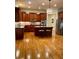 Well-appointed kitchen features wood cabinetry, a central island, and stainless steel appliances at 4020 Toulon Ln, Cumming, GA 30040